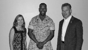 Elizabeth Birch (l), chapter treasurer, and Mark Witzel (r), chapter president, thank Master Gunnery Sgt. Byron Bissessar, USMC, communications chief at Headquarters Marine Corps Command, Control, Communications and Computers, for serving as the speaker in June.